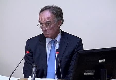 A still image from broadcast footage shows former News of the World lawyer Tom Crone speaking at the Leveson Inquiry at the High Court in central London December 13, 2011.
