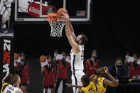 Virginia's Jay Huff dunks over Virginia in the first half of an NCAA college basketball game, Wednesday, Nov. 25, 2020, in Uncasville, Conn. (AP Photo/Jessica Hill)