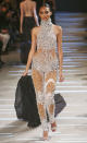 <b>Alexandre Vauthier SS13 </b><br><br>Models walked the catwalk in revealing embellished jumpsuits with matching heels.<br><br>© Rex