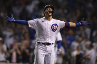 Chicago Cubs' Willson Contreras celebrates at the dugout after hitting a solo home run in the eighth inning of a baseball game against the Cincinnati Reds, Monday, July 26, 2021, in Chicago. (AP Photo/Paul Beaty)