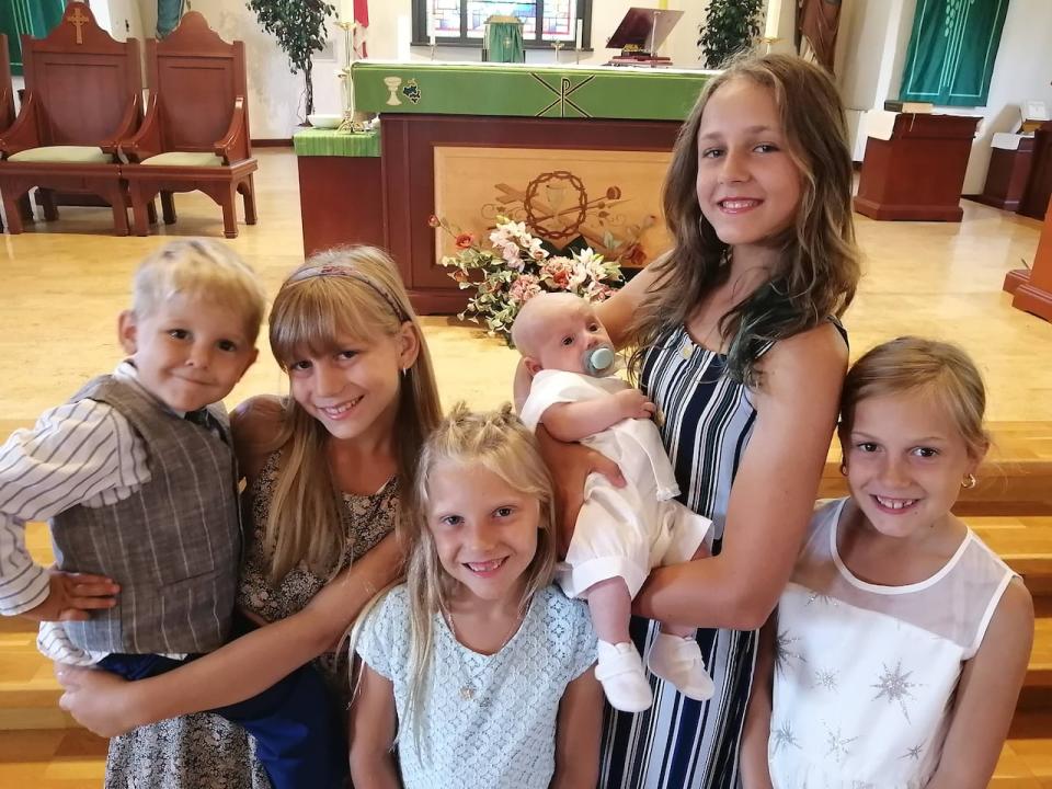 Charlotte Light, second from right, poses with her five younger siblings. The 14-year-old died on Aug. 30, 2024, after being struck by the driver of a car as she biked near Long Sault, Ont.