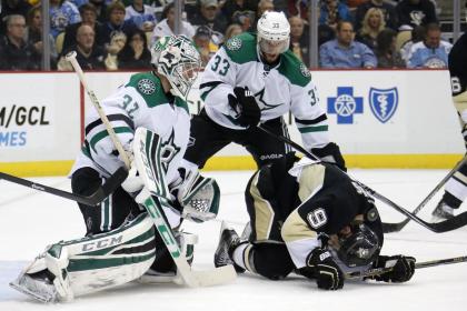 Dupuis was hit in the back of the head by a shot in his third game back. He was stretchered off the ice. (AP)