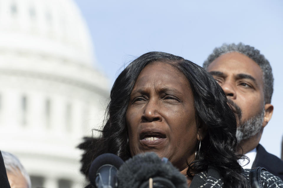 Congressional Black Caucus Chairman Rep. Steven Horsford, D-Nev., rear, looks on while RowVaughn Wells, left, mother of Tyre Nichols, who died after being beaten by Memphis police officers, speaks with reporters about police reform, on Capitol Hill in Washington, Tuesday, Feb. 7, 2023. (AP Photo/Cliff Owen)