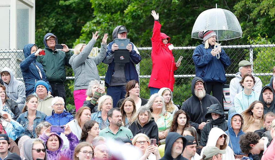 Despite a cold rain, hundreds of families and friends came to cheer during Weymouth High's graduation on Saturday, June 3, 2023.