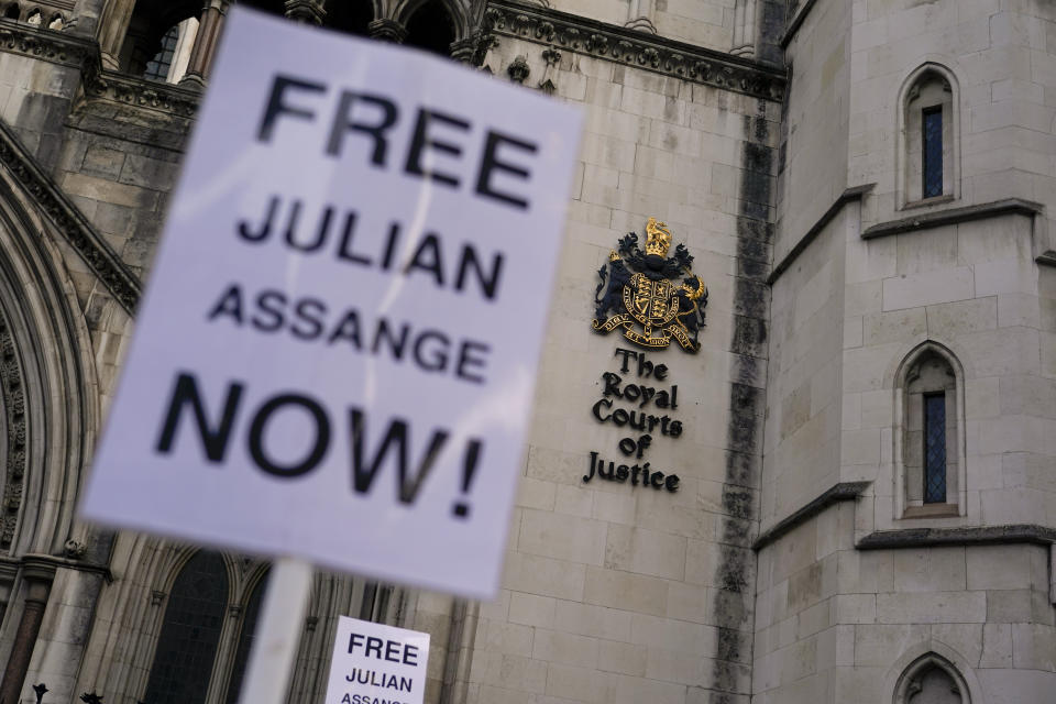 A banner is left outside the Royal Courts of Justice in London, Tuesday, Feb. 20, 2024. WikiLeaks founder Julian Assange will make his final appeal against his impending extradition to the United States at the court. (AP Photo/Alberto Pezzali)