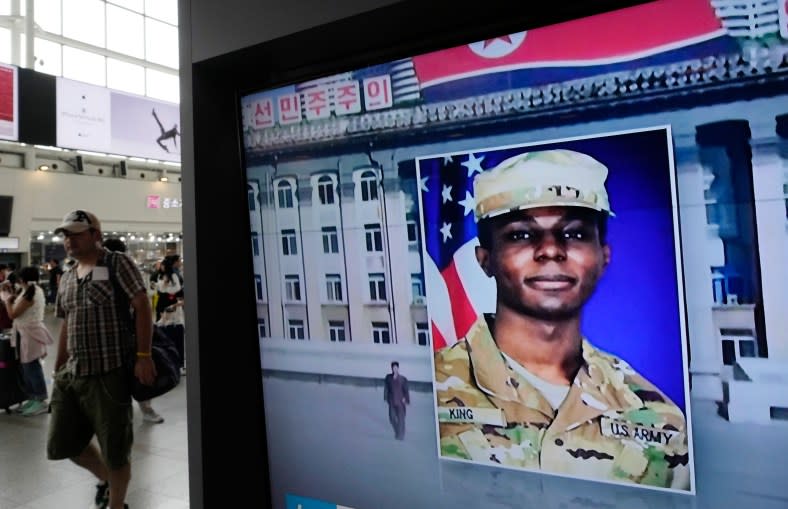 A TV screen shows a file image of American soldier Travis King during a news program at the Seoul Railway Station in Seoul, South Korea on Aug. 16, 2023. (AP Photo/Ahn Young-joon)