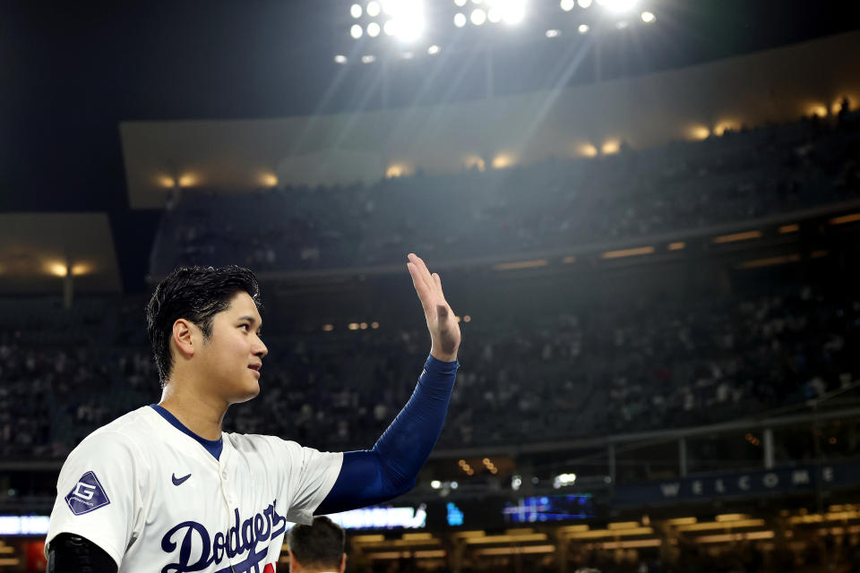 LOS ANGELES, CALIFORNIA - AUGUST 23: Shohei Ohtani #17 of the Los Angeles Dodgers waves to the crowd after hitting a walk-off grand slam home run, his 40th home run of the season, against the Tampa Bay Rays at Dodger Stadium on August 23, 2024 in Los Angeles, California. (Photo by Katelyn Mulcahy/Getty Images)