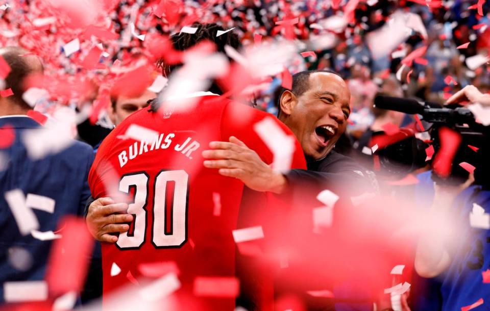 N.C. State’s head coach Kevin Keatts hugs DJ Burns Jr. (30) after N.C. State’s 84-76 victory over UNC in the championship game of the 2024 ACC Men’s Basketball Tournament at Capital One Arena in Washington, D.C., Saturday, March 16, 2024.