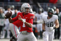 Ohio State quarterback C.J. Stroud drops back to pass against Michigan State during the first half of an NCAA college football game Saturday, Nov. 20, 2021, in Columbus, Ohio. (AP Photo/Jay LaPrete)