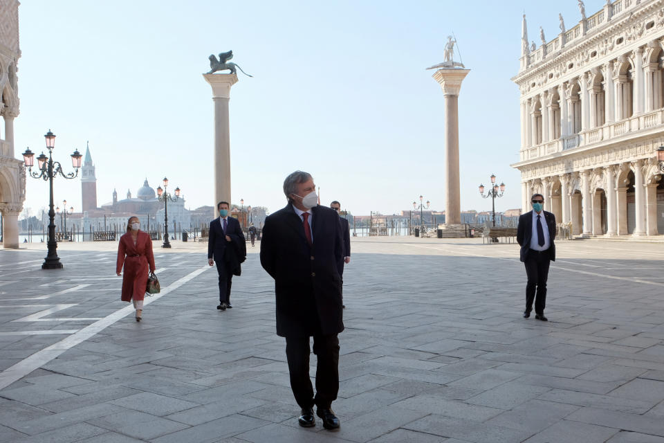 The mayor of Venice, Luigi Brugnaro, wears a protective mask as he walks in St Mark's Square on Easter Sunday, as Italy remains on lockdown due to a spread of the coronavirus disease (COVID-19), in Venice, Italy, April 12, 2020. REUTERS/Manuel Silvestri