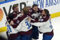 The Colorado Avalanche celebrate after the team defeated the Tampa Bay Lightning in Game 6 of the NHL hockey Stanley Cup Finals on Sunday, June 26, 2022, in Tampa, Fla. The Avalanche won 2-1. (AP Photo/John Bazemore)