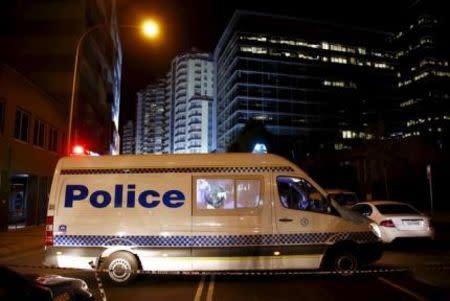 A police van blocks a street outside the New South Wales (NSW) state police headquarters located in the Sydney suburb of Parramatta, Australia, October 2, 2015. REUTERS/David Gray