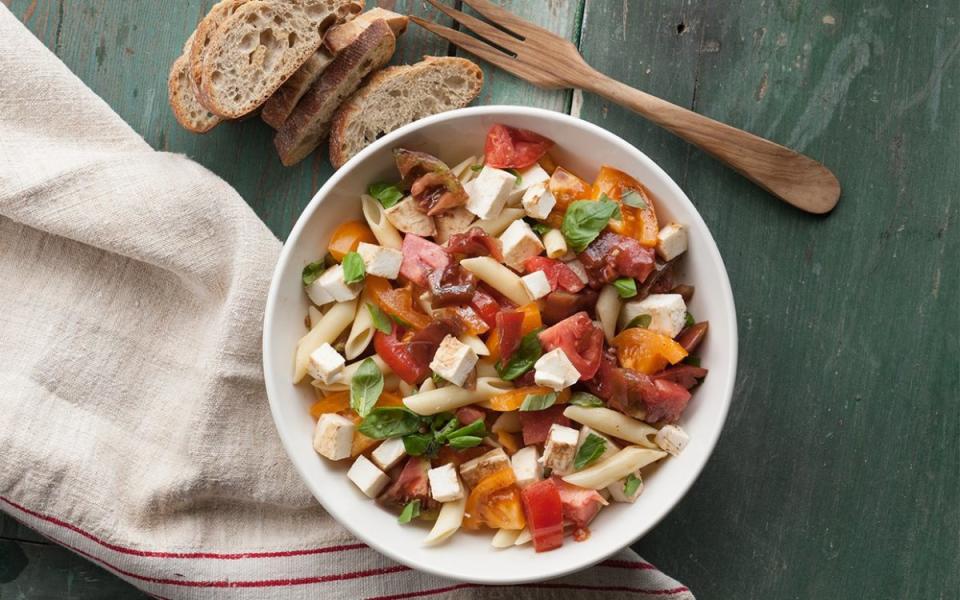 <p>This one-pot meal is inspired by the Italian caprese salad, made of sliced tomatoes, fresh mozzarella and basil leaves. It’s delicious warm or cold and pairs perfectly with ribs</p><p><strong>Get the recipe: </strong><strong><a href="https://parade.com/842370/communitytable/caprese-pasta-salad/" rel="nofollow noopener" target="_blank" data-ylk="slk:Caprese Pasta Salad;elm:context_link;itc:0;sec:content-canvas" class="link ">Caprese Pasta Salad</a></strong></p>