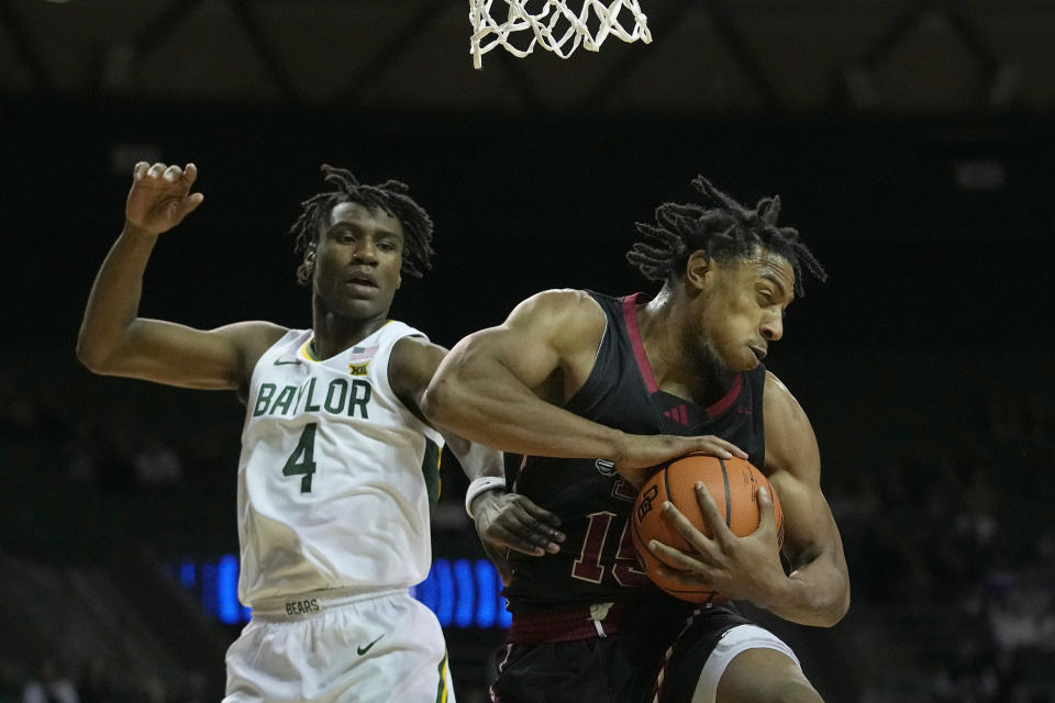 Nicholls State forward Jamal West Jr. grabs a rebound in front of Baylor guard Ja'Kobe Walter (4) during the first half of an NCAA college basketball game in Waco, Texas, Tuesday, Nov. 28, 2023. (AP Photo/LM Otero)