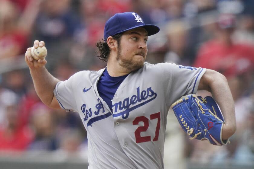 FILE - Los Angeles Dodgers starting pitcher Trevor Bauer (27) delivers in the first inning of a baseball game against the Atlanta Braves Sunday, June 6, 2021, in Atlanta. Former major league pitcher Trevor Bauer and a woman who accused him of beating and sexually assaulting her in 2021 have settled their legal dispute, Bauer's attorneys said Monday, Oct. 2, 2023. (AP Photo/Brynn Anderson, File)