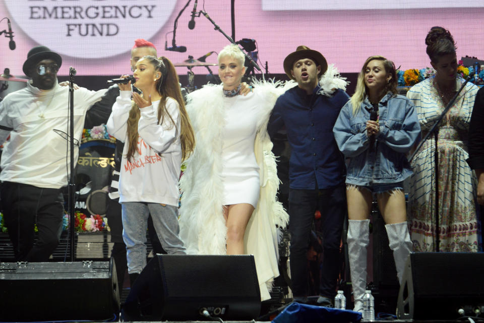 In this handout provided by 'One Love Manchester' benefit concert (L-R) will.i.am, Taboo, Ariana Grande, Katy Perry, Niall Horan, Miley Cyrus and Imogen Heap on stage on June 4, 2017 in Manchester, England. Donate at www.redcross.org.uk/love&nbsp;