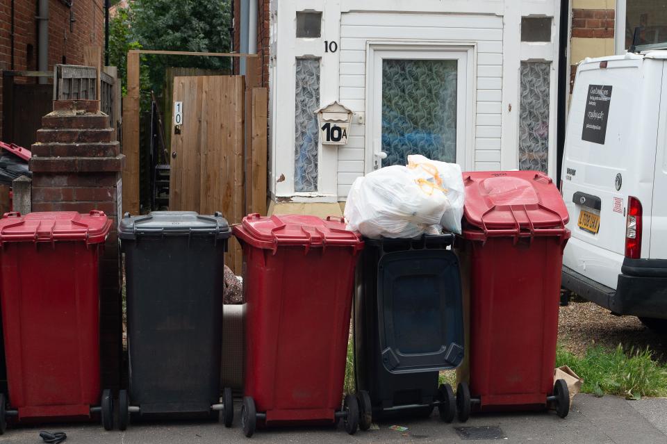 Slough, Berkshire, UK. 3rd August, 2023. Overflowing bins and black bin bags outside homes in Slough, Berkshire. Slough Borough Council (SBC) have recently introduced a change to residents' bin collections with a view to encouraging residents to recycle more. Grey bins with general waste including food, are now collected once a fortnight rather than once a week, with recycling in red bins, being collected on the alternate week. Some Slough residents are now reporting issues with maggots and smells from uncollected rubbish left on streets which is only likely to get worse once the temperatures