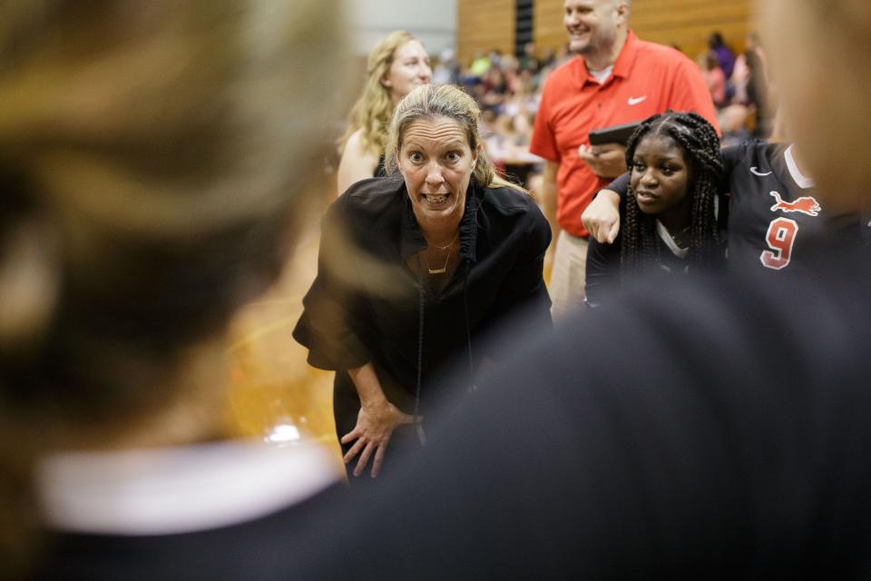 Leon head coach Angie Strickland talks to her team during a time out. The Chiles Timberwolves upset the Leon Lions in a 3-2 victory Tuesday, Aug. 31, 2021.