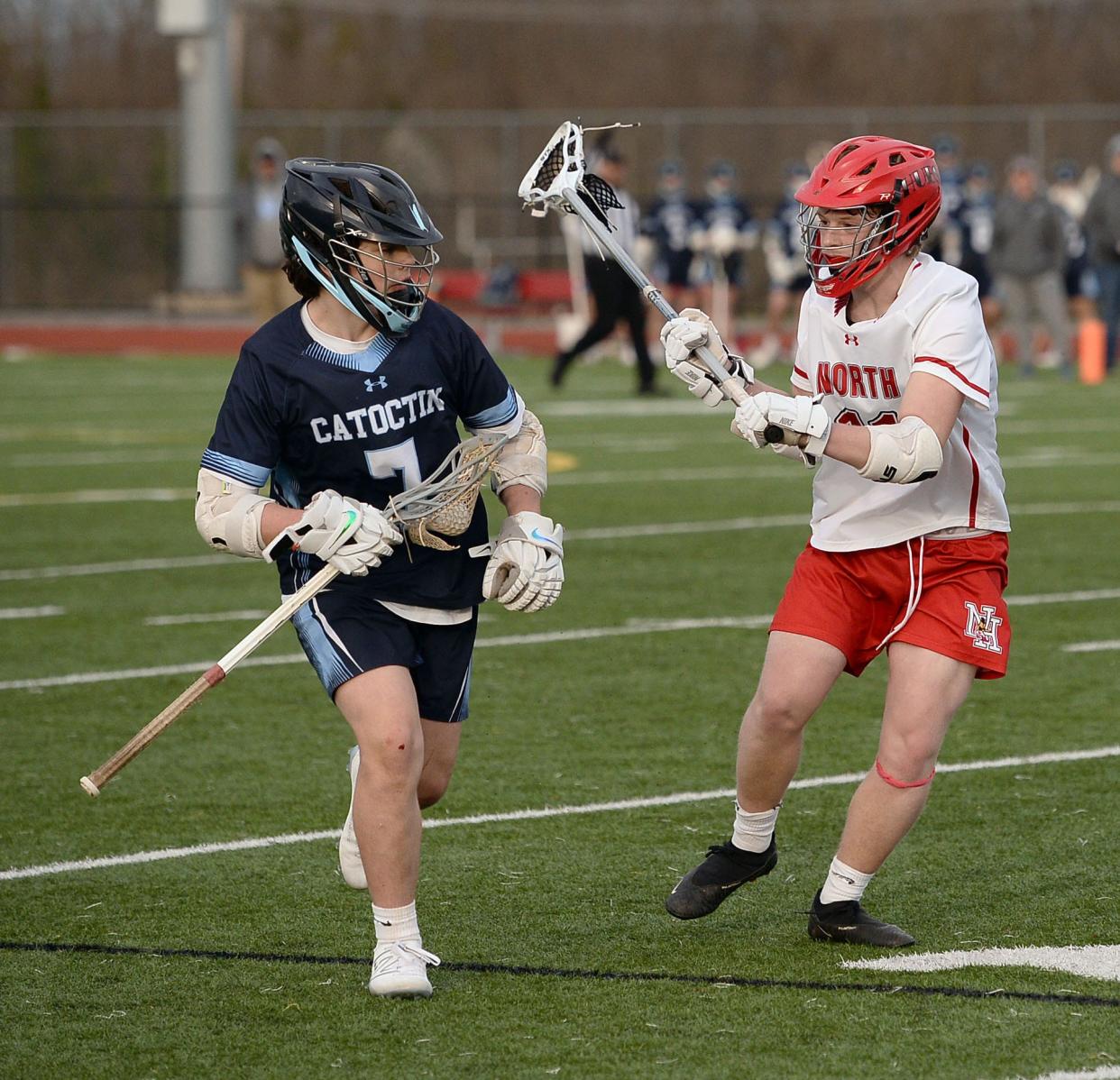 North Hagerstown's Aiden Clark defends against Catoctin's Ethan Williams.