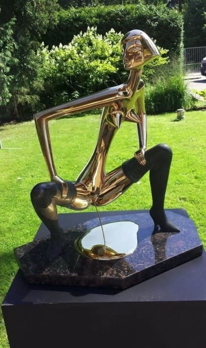 A statue of someone peeing