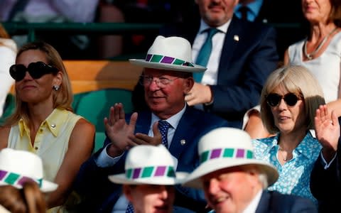 Sir Alex Ferguson and Sir David Attenboroigh put on the Panama hats - Credit: ADRIAN DENNIS/AFP/Getty Images