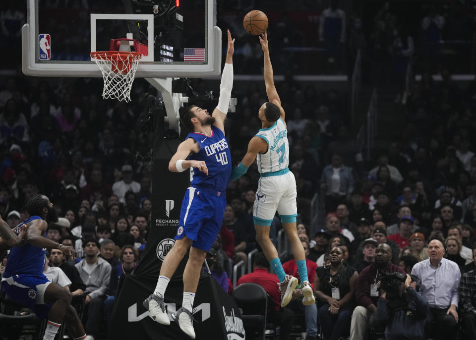 Charlotte Hornets guard Bryce McGowens (7) shoots against Los Angeles Clippers center Ivica Zubac (40) during the first half of an NBA basketball game in Los Angeles, Tuesday, Dec. 26, 2023. (AP Photo/Ashley Landis)
