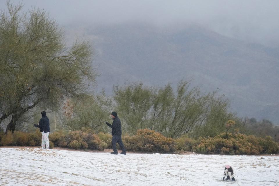 Snow and hail accumulates on the ground in north Scottsdale leaving a light dusting of winter weather on Jan. 7, 2024.