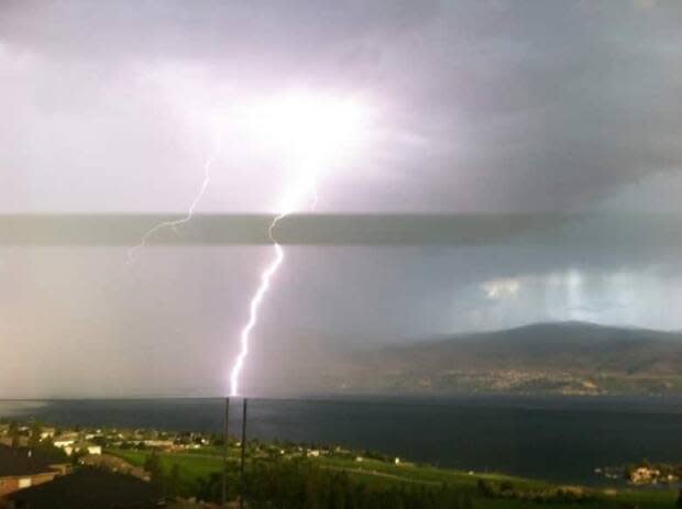 Lightning strikes Okanagan Lake as seen from West Kelowna, B.C., in 2019. (Submitted by Alex Tilley - image credit)
