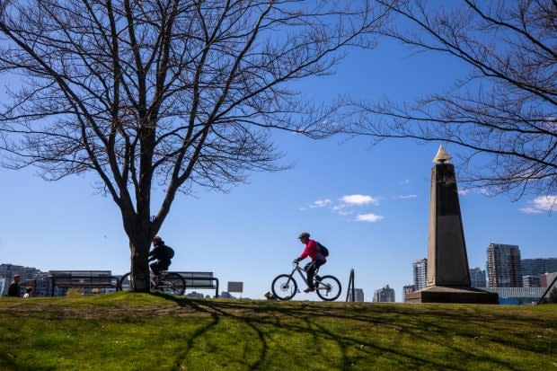 A cyclist is pictured along the seawall in Vancouver on Monday.