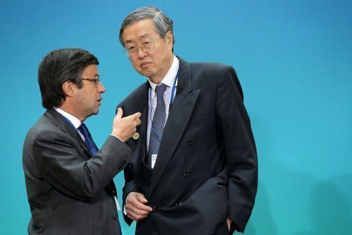 Governor of the People's Bank of China Zhou Xiaochuan (R) listens to president of the Inter-American Development Bank Luis Alberto Moreno (L) during the G-20 Finance Ministers and Central Bank Governors Meeting at the International Monetary Fund in Washington. The IMF raised $430 billion in new funds for crisis intervention