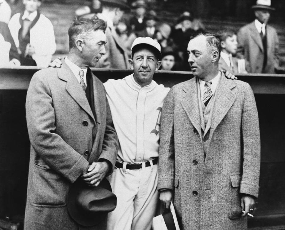 Three members of the famed $100,000 infield of the 1911 Philadelphia Athletics are shown prior to start of third game of the 1929 World Series game at Shibe Park in Philadelphia on Oct 11, 1929. From left to right are Frank "Home Run" Baker, who played third; Eddie Collins, second base, and Jack Barry, shortstop. Series was played between Chicago Cubs and Philadelphia A's with whom Collins ended career in 1930.