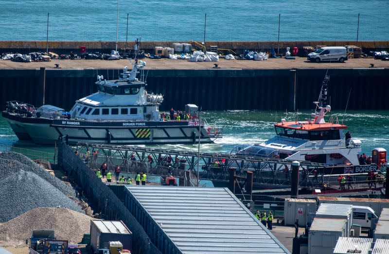 Migrants arrive in the UK after crossing the English Channel