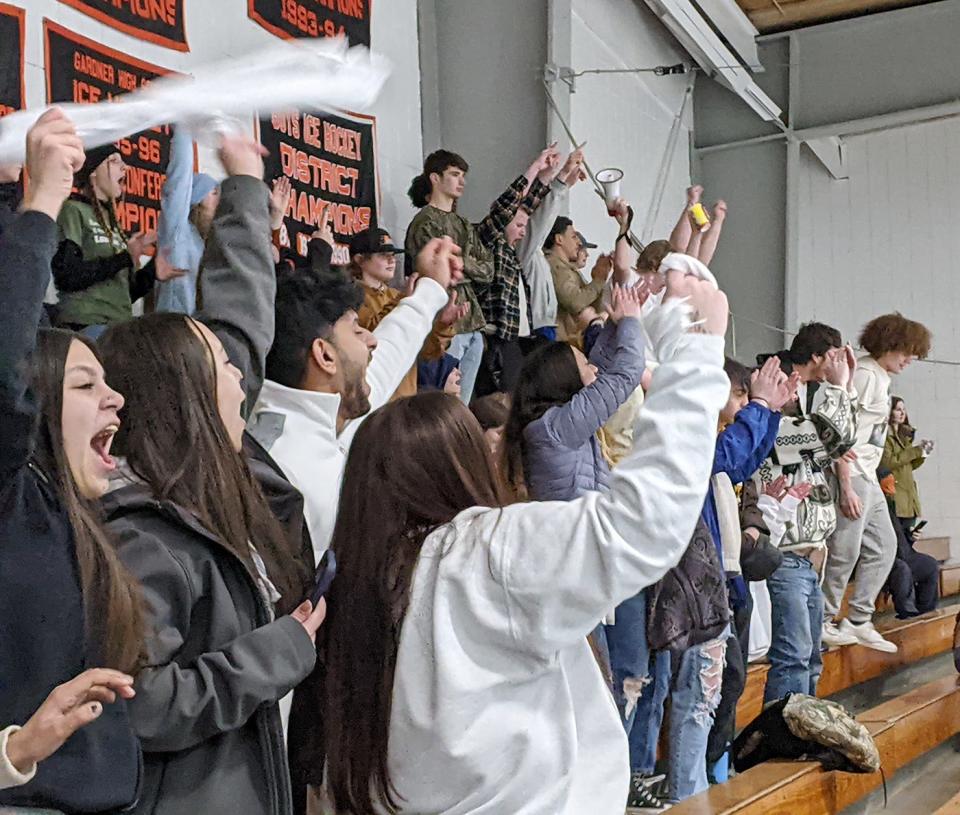 Student fans of the Gardner/Murdock boys ice hockey team celebrate the Wildcats' 5-2 victory over St. Bernard's in a Central Mass. Class C semifinal, Wednesday, at Veterans Arena in Gardner.