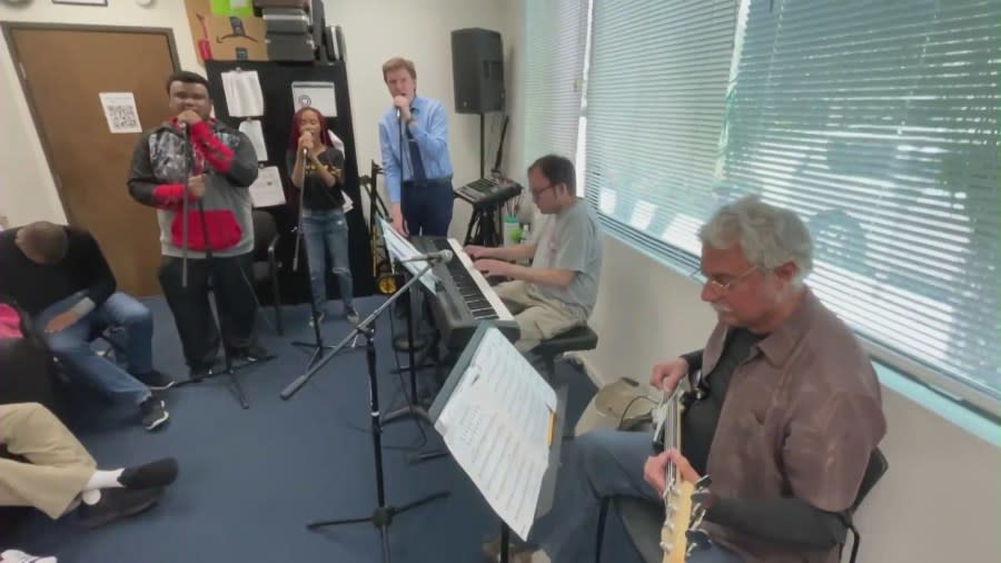 Students making music at a practice session with Jazz Hands for Autism. (KTLA)