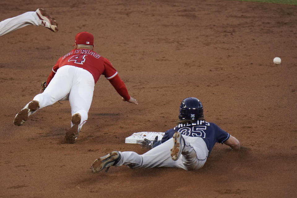 Tampa Bay Rays' Brett Phillips, right, steals second base as Los Angeles Angels' Jose Iglesias misses the throw during the third inning of a baseball game Thursday, May 6, 2021, in Anaheim, Calif. Phillips advanced to third on the errant throw. (AP Photo/Jae C. Hong)