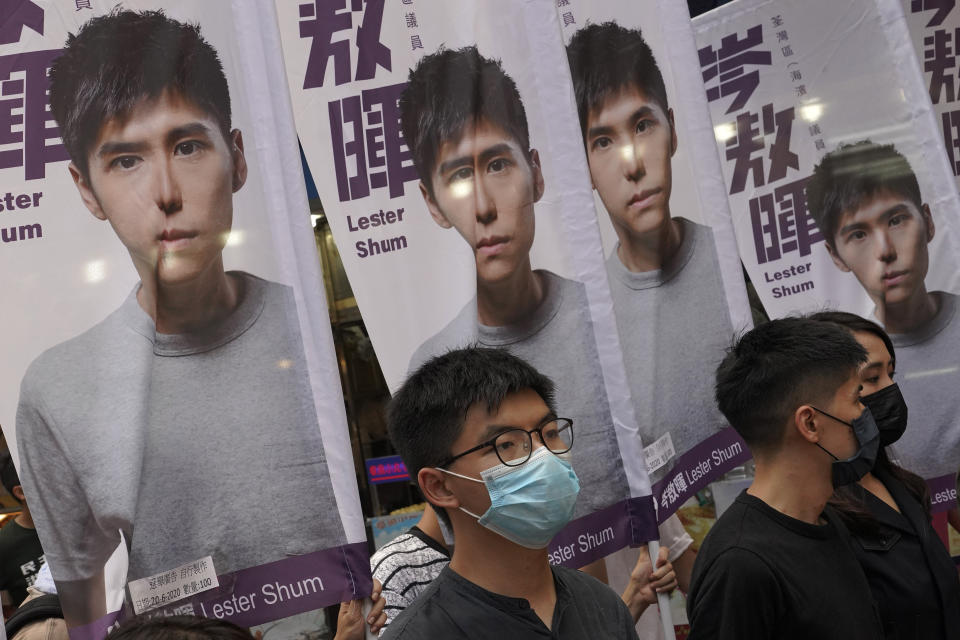 Hong Kong activist Joshua Wong attends an activity for the upcoming Legislative Council elections in Hong Kong Saturday, June 20, 2020. Wong said Thursday that opposing a draft national security law for Hong Kong “could be my last testimony (while) I am still free.” (AP Photo/Vincent Yu)