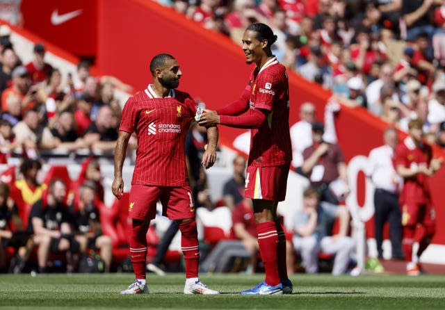 Mohamed Salah and Virgil Van Dijk talk on the pitch