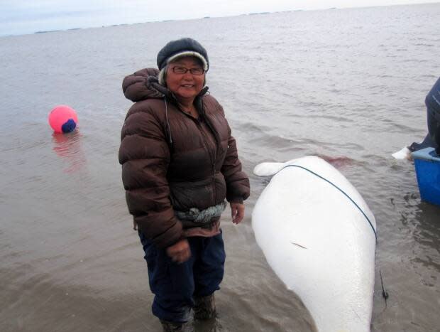 Nellie Pokiak sampling a beluga. (Submitted by Lisa Loseto - image credit)