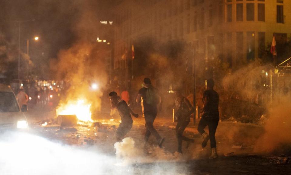 Riot police fire tear gas at anti-government protesters in Beirut on Thursday night.