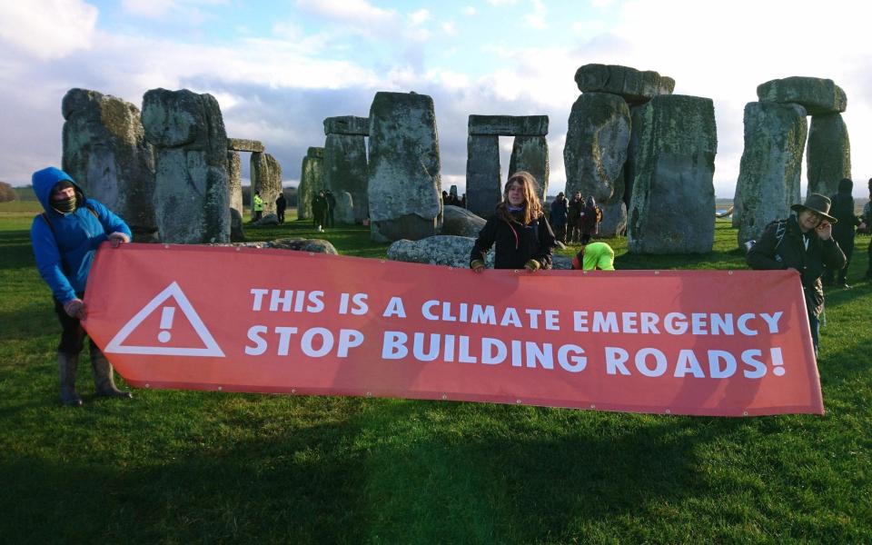 Extinction Rebellion protesters joined the demonstration at Stonehenge on Saturday - TWITTER