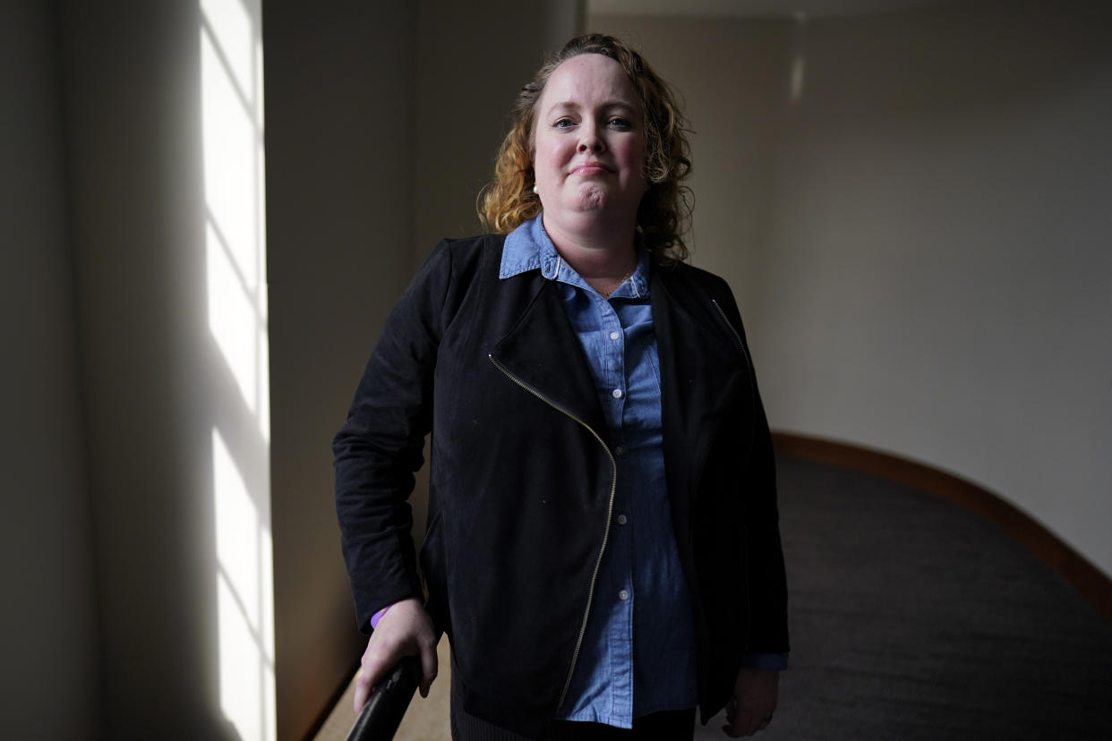 Sara Hayden Parris, member of Annie's Foundation, which opposes efforts to remove books from school libraries, poses for a portrait, Thursday, March 2, 2023, in Ames, Iowa. Iowa Republican Gov. Kim Reynolds is backing a bill that could result in the removal of books from school libraries in all 327 districts if they are successfully challenged in any one of them. (AP Photo/Charlie Neibergall)