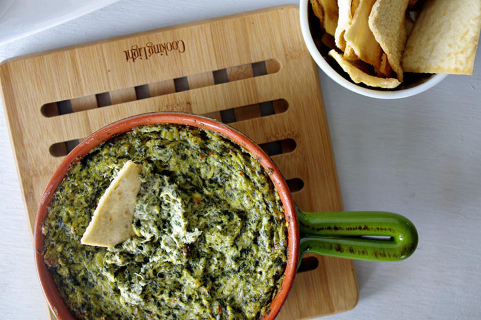 <p>Shea Goldstein</p><p>Gouda cheese is the key to the ooey-gooey factor of this dip.</p><p><strong>Get the recipe: <a href="https://parade.com/1074200/sheagoldstein/cheesy-spinach-artichoke-dip-recipe/" rel="nofollow noopener" target="_blank" data-ylk="slk:Cheesy Spinach Artichoke Dip;elm:context_link;itc:0;sec:content-canvas" class="link ">Cheesy Spinach Artichoke Dip</a></strong></p>