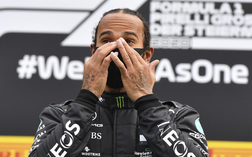 Mercedes driver Lewis Hamilton of Britain celebrates on the podium after winning the Styrian Formula One Grand Prix at the Red Bull Ring racetrack in Spielberg, Austria, Sunday, July 12, 2020. (Joe Klamar/Pool via AP)