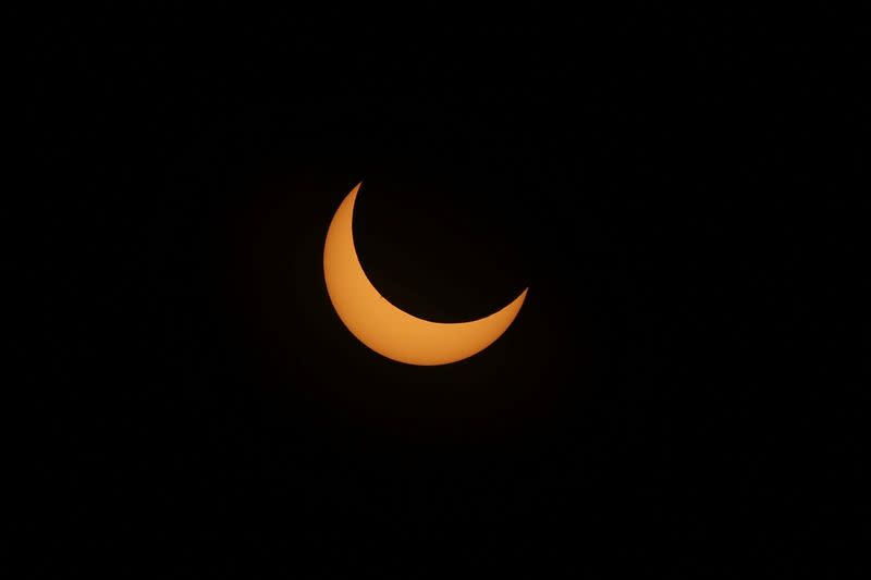 A solar eclipse is seen over Mexico