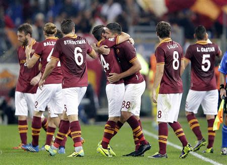 AS Roma's Marco Borriello (3rd R) celebrates with his team mates after scoring against Chievo Verona during their Italian Serie A soccer match at the Olympic stadium in Rome October 31, 2013. REUTERS/Max Rossi