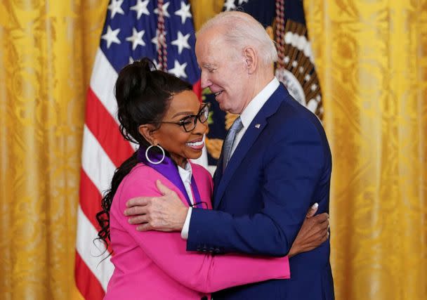 PHOTO: National Medal of Arts recipient singer Gladys Knight hugs President Joe Biden as he presents her the medal during a ceremony in the East Room at the White House in Washington, D.C., March 21, 2023. (Kevin Lamarque/Reuters)