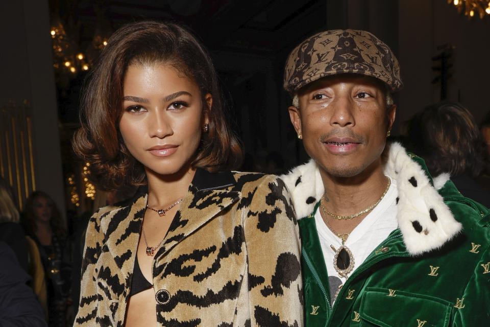 Zendaya, left, and Pharrell Williams attend the Louis Vuitton Fall/Winter 2023-2024 ready-to-wear collection presented Monday, March 6, 2023 in Paris. (Vianney Le Caer/Invision/AP)