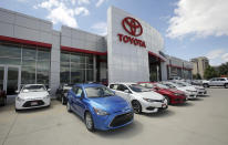 FILE - This Tuesday, June 13, 2017, file photo shows the Mark Miller Toyota dealership in Salt Lake City. When U.S. President Donald Trump visits Japan, he’ll be able to point to Tokyo’s streets to drive home a sore point in trade relations between the allies: the absence of made-in-USA vehicles. While Trump complained repeatedly about the trade imbalance, especially in autos and auto parts - the Hondas and Toyotas on U.S. roads are a daily reminder. (AP Photo/Rick Bowmer, File)