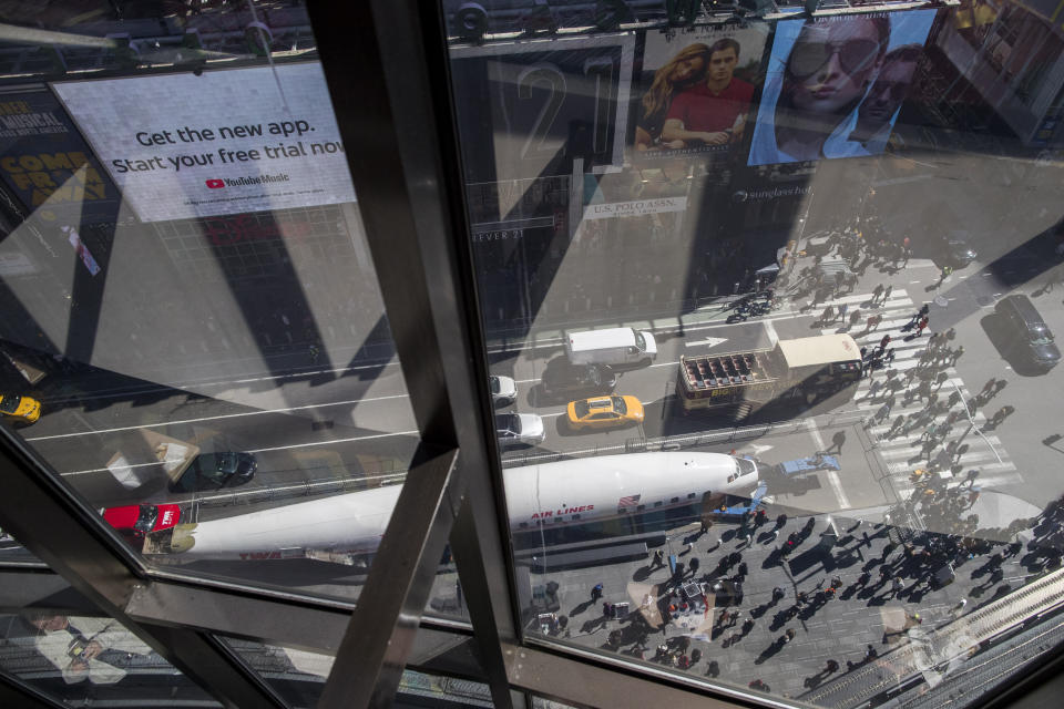 A Lockheed Constellation L-1649A Starliner, known as the "Connie, is parked in New York's Times Square during a promotional event, Saturday, March 23, 2019, in New York. The vintage commercial airplane will serve as the cocktail lounge outside the TWA Hotel at JFK airport. (AP Photo/Mary Altaffer)