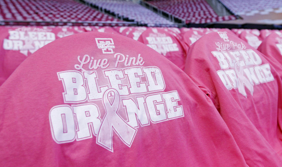 Pink tee shirts cover seats at Thompson Boling Arena prior to an NCAA college basketball game between the Tennessee and the Kentucky Sunday, Feb. 16, 2014, in Knoxville, Tenn. (AP Photo/Wade Payne)